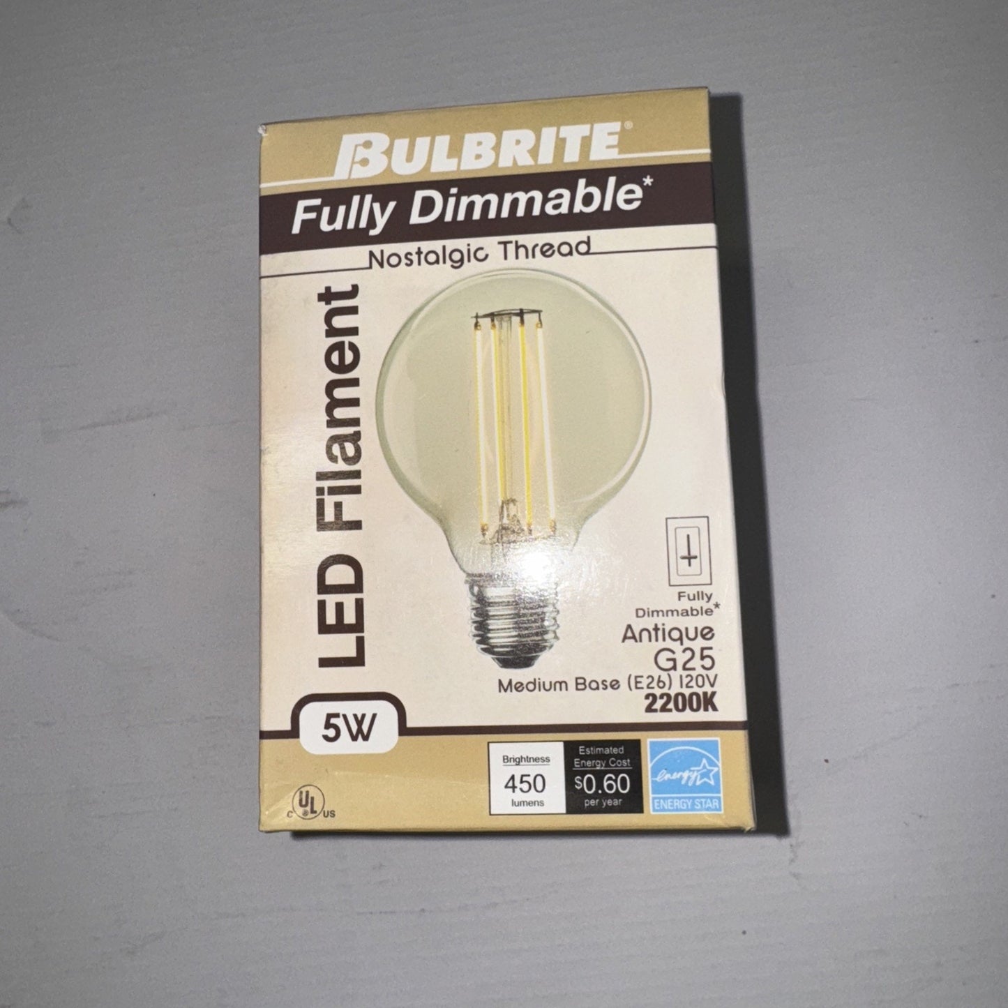 Bulbrite Fully Dimmable 5W LED Filament Antique G25 light bulb with medium base and 2200K warm glow on packaging front