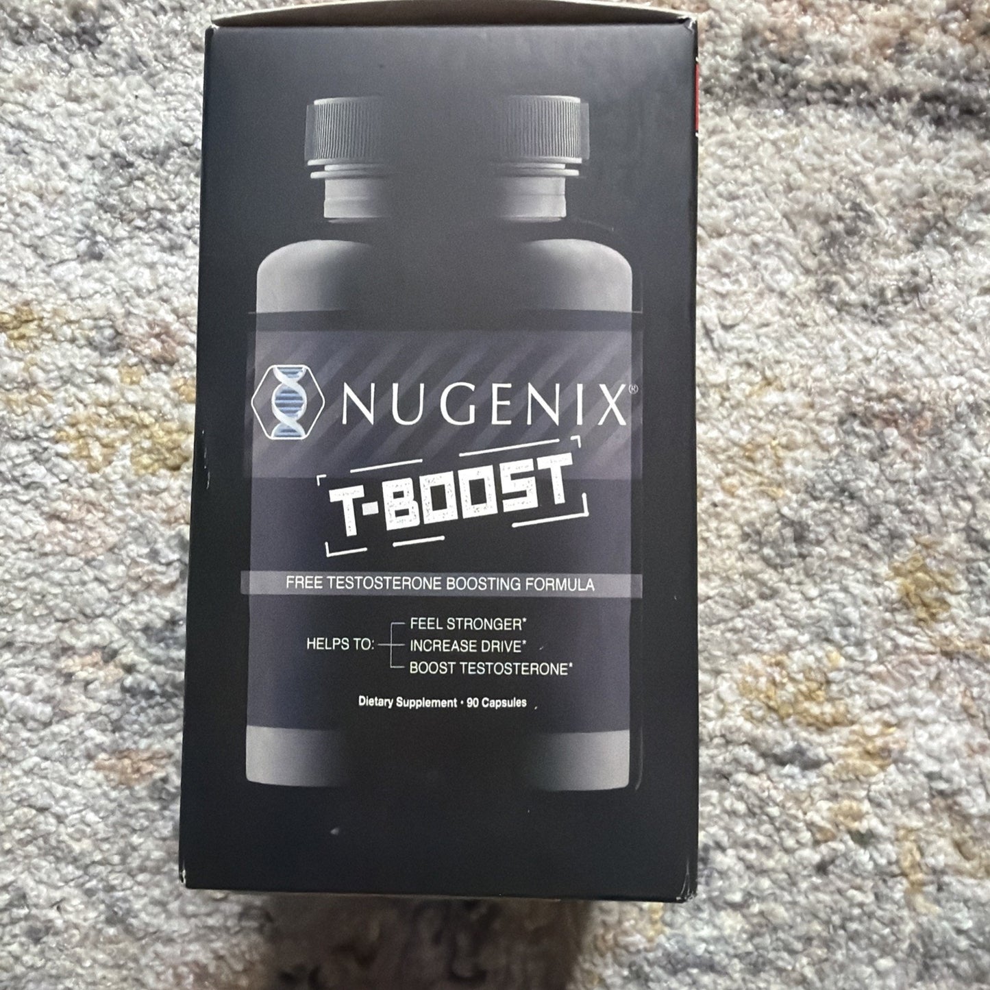 Black rectangular box featuring two dark bottles and labeled as a free testosterone boosting formula with benefits to feel stronger, increase drive, and boost testosterone, containing 90 capsules.
