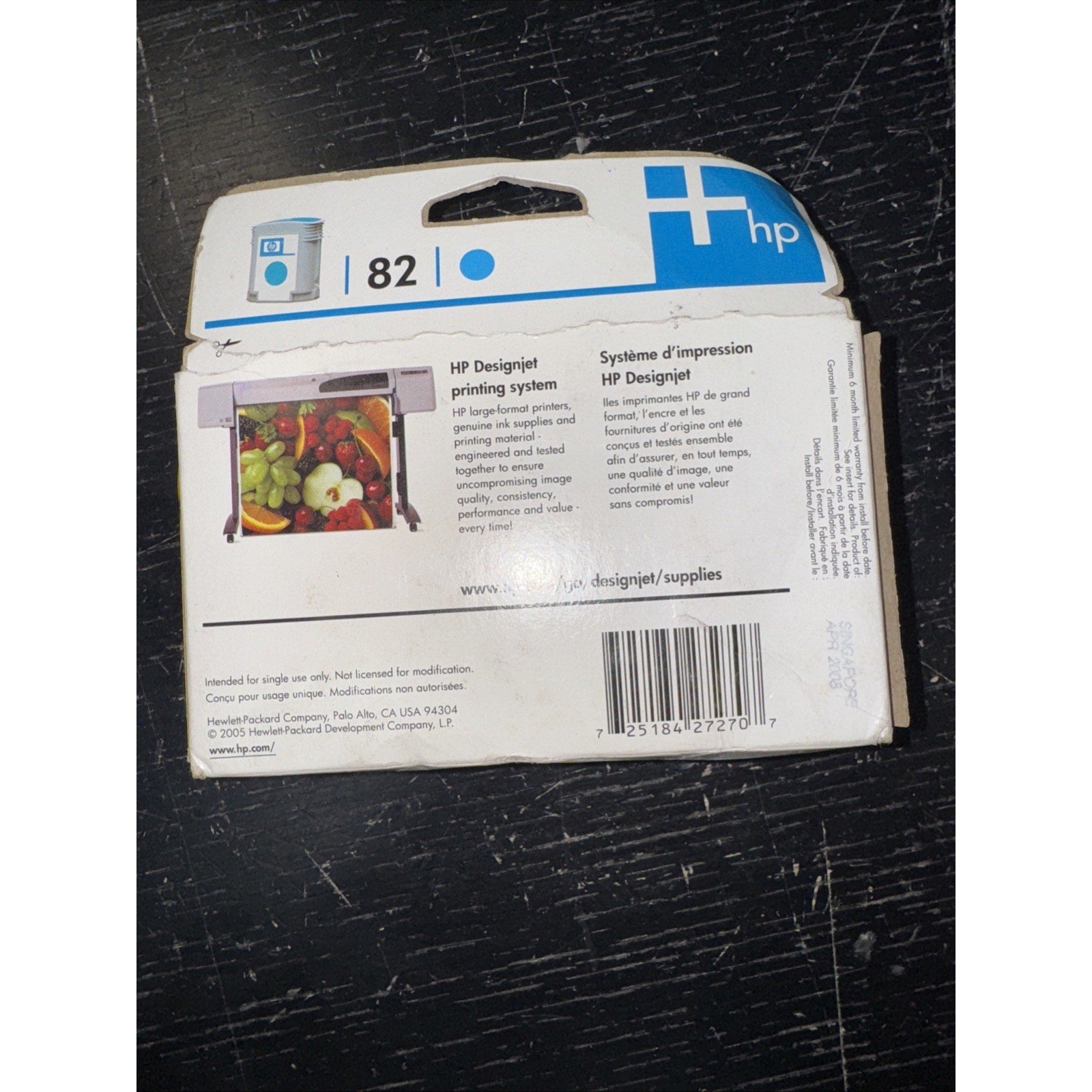 Genuine HP 82 cyan ink cartridge sealed box with product and printing system information on back panel