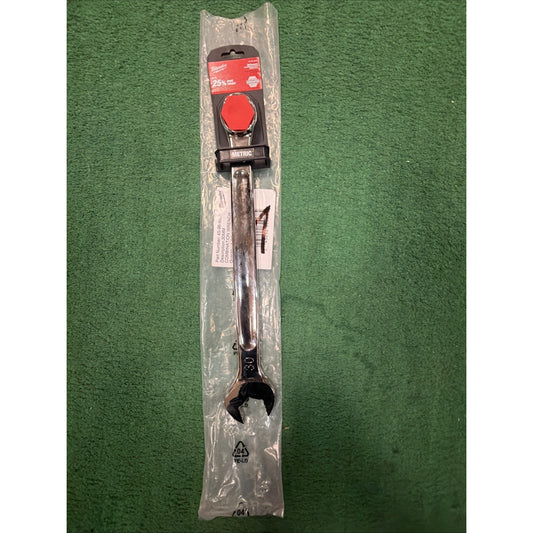 Metal open-end wrench with a polished finish, sealed in clear plastic packaging, resting on a green textured surface with a red label attached to the top.