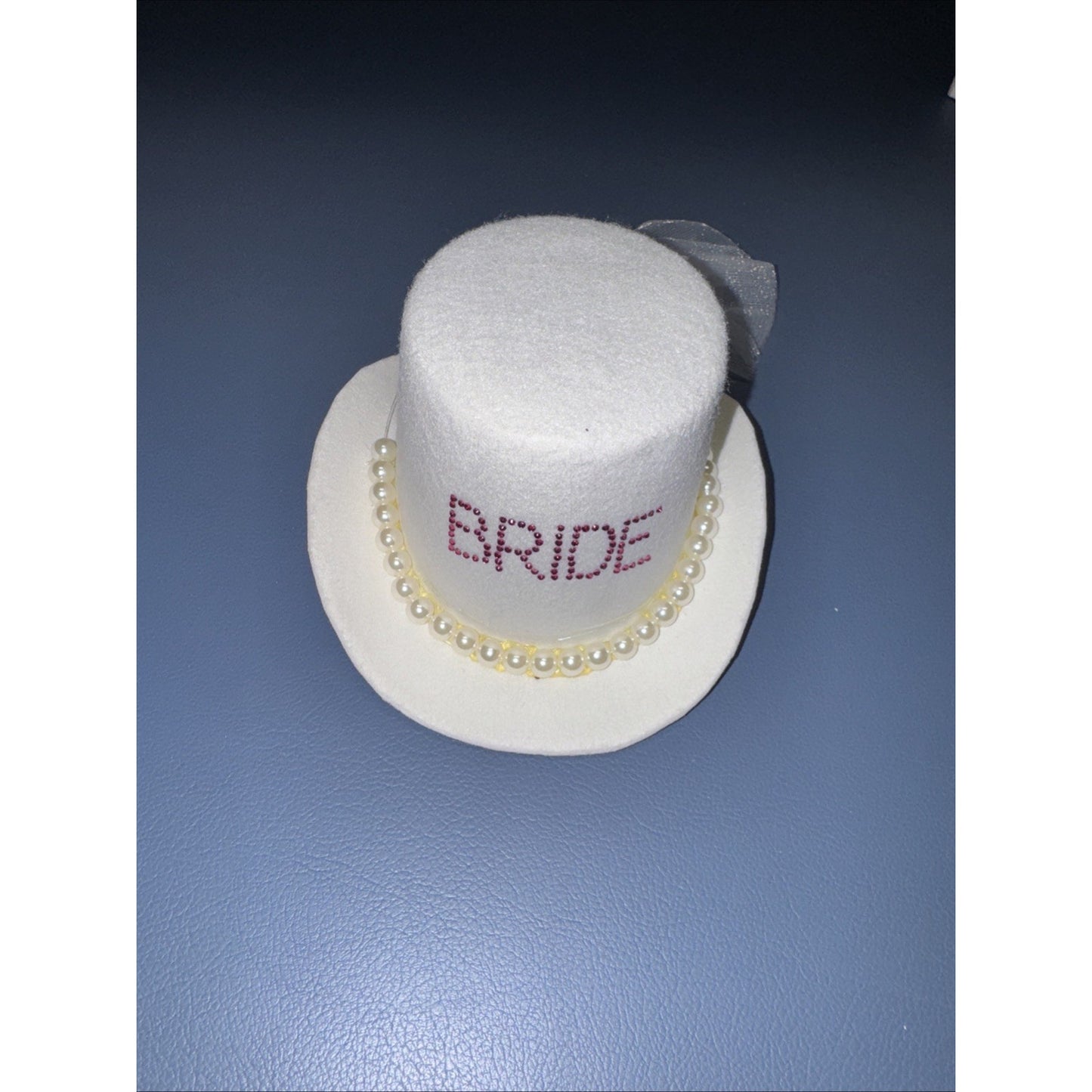 White bride mini top hat fascinator with clip-on pearl trim and tulle bow for bachelorette or wedding accessory