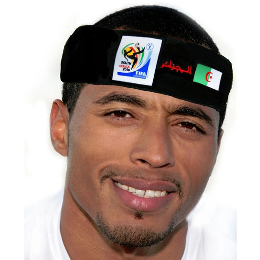 Man smiling and wearing a black headband featuring the 2010 FIFA World Cup South Africa logo, the Algerian flag, and Arabic text on a white background.