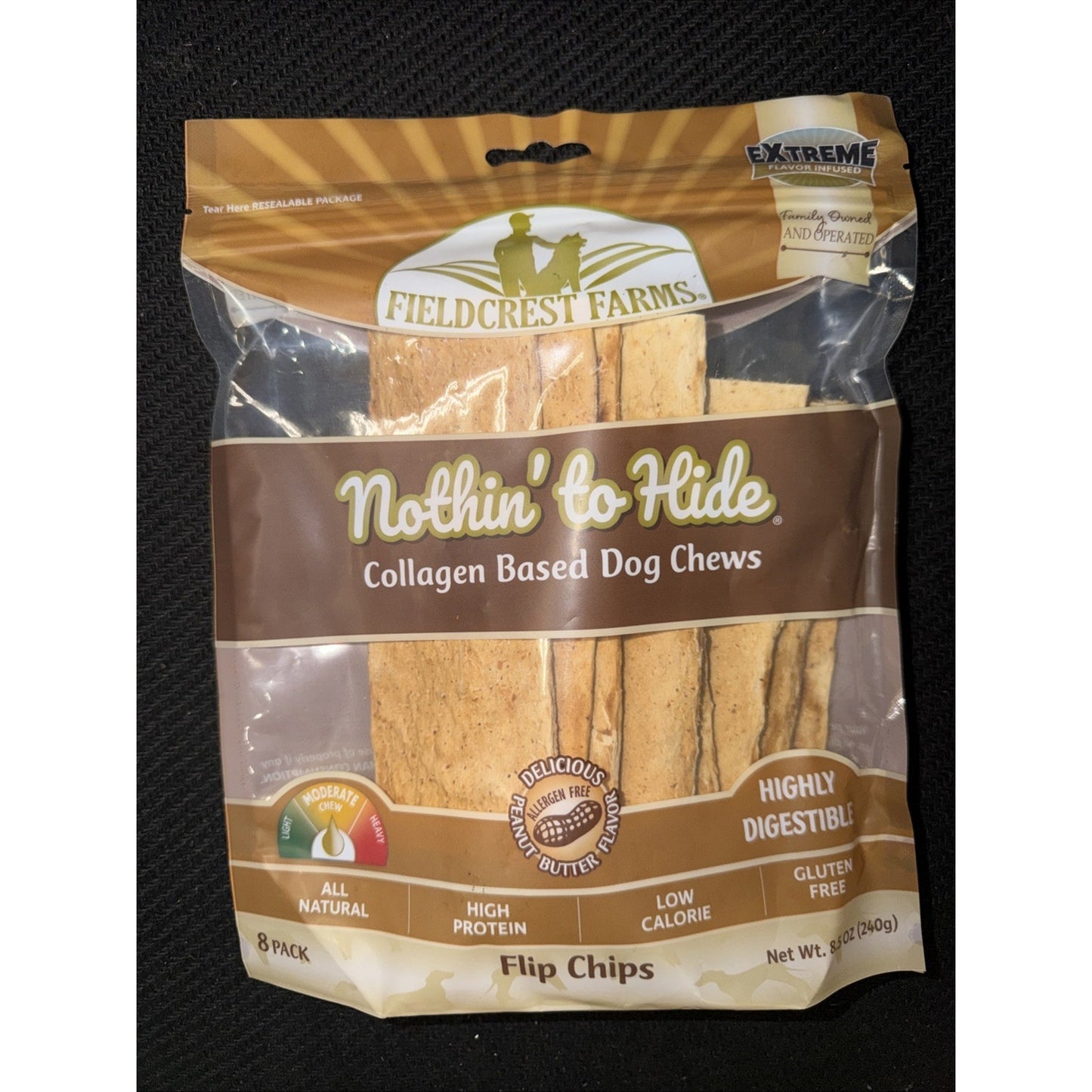 Resealable packaging of Fieldcrest Farms Nothin' to Hide collagen-based dog chews featuring Flip Chips, highlighting all natural ingredients, high protein, low calorie, gluten free, and peanut butter flavor on a black background.