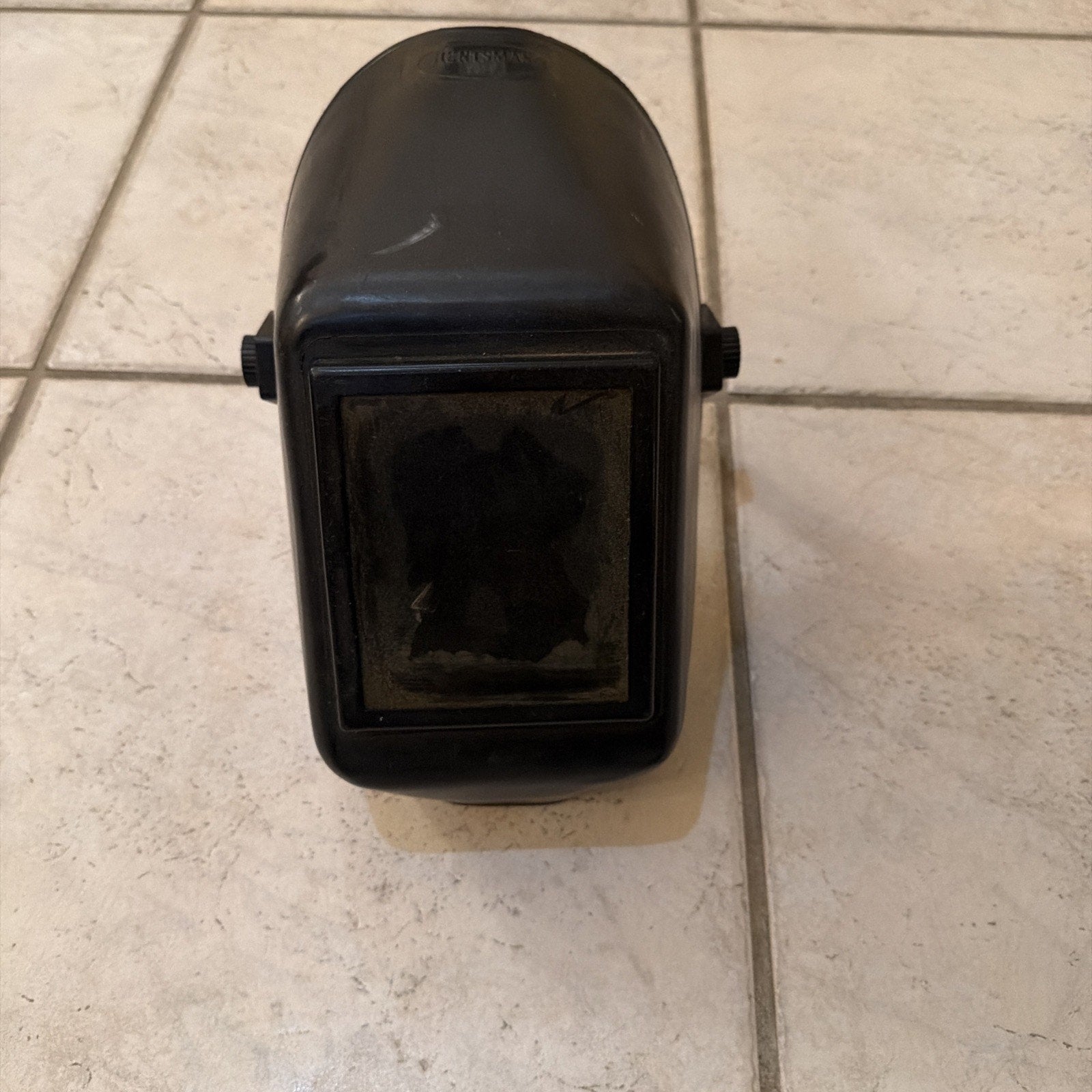 Jackson Safety HSL100 Glory Welding Helmet PRO-V auto-darkening helmet shown on tiled floor front view