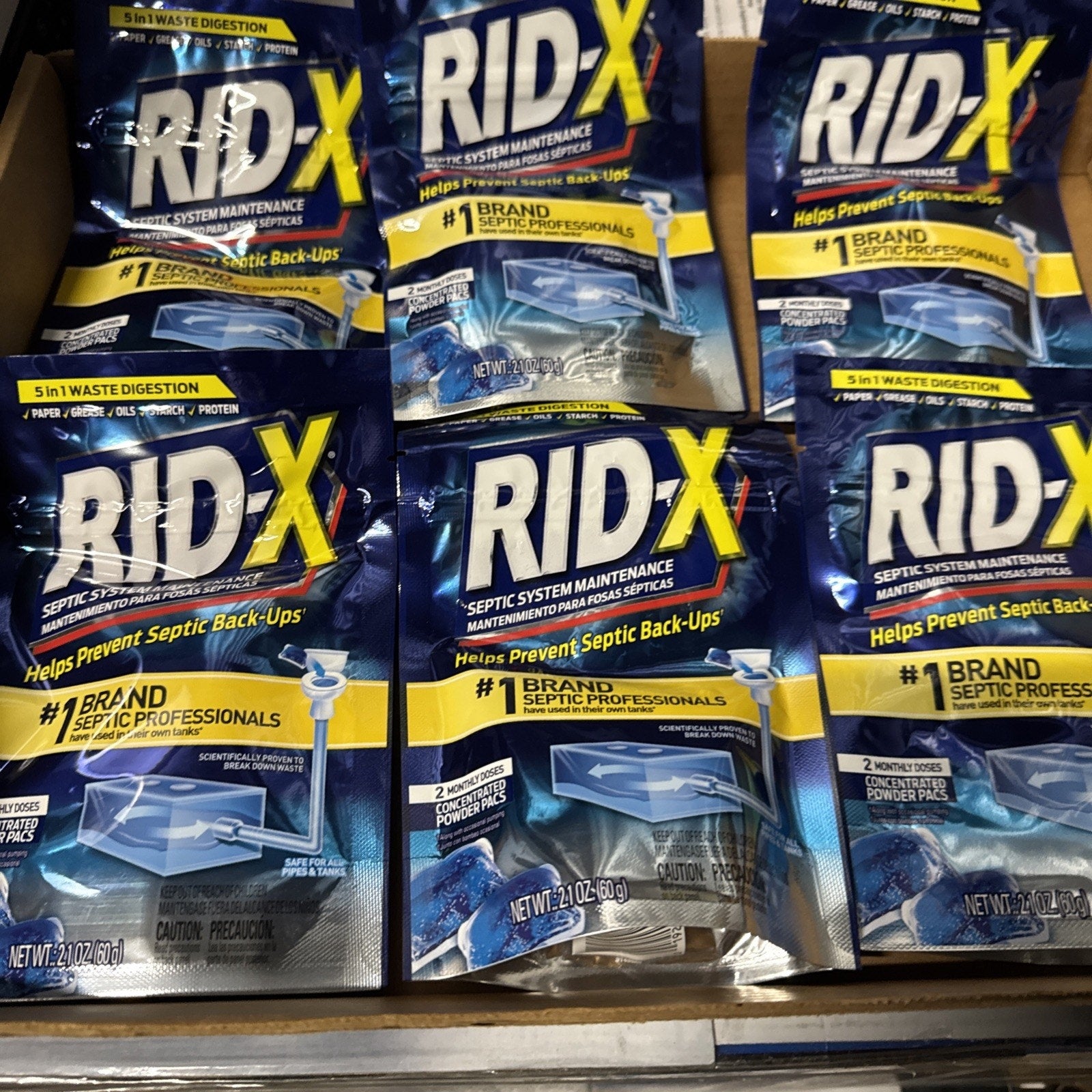 Lot of 6 Rid-X Septic System Maintenance Powder packs showing packaging with brand and product details in blue and yellow design