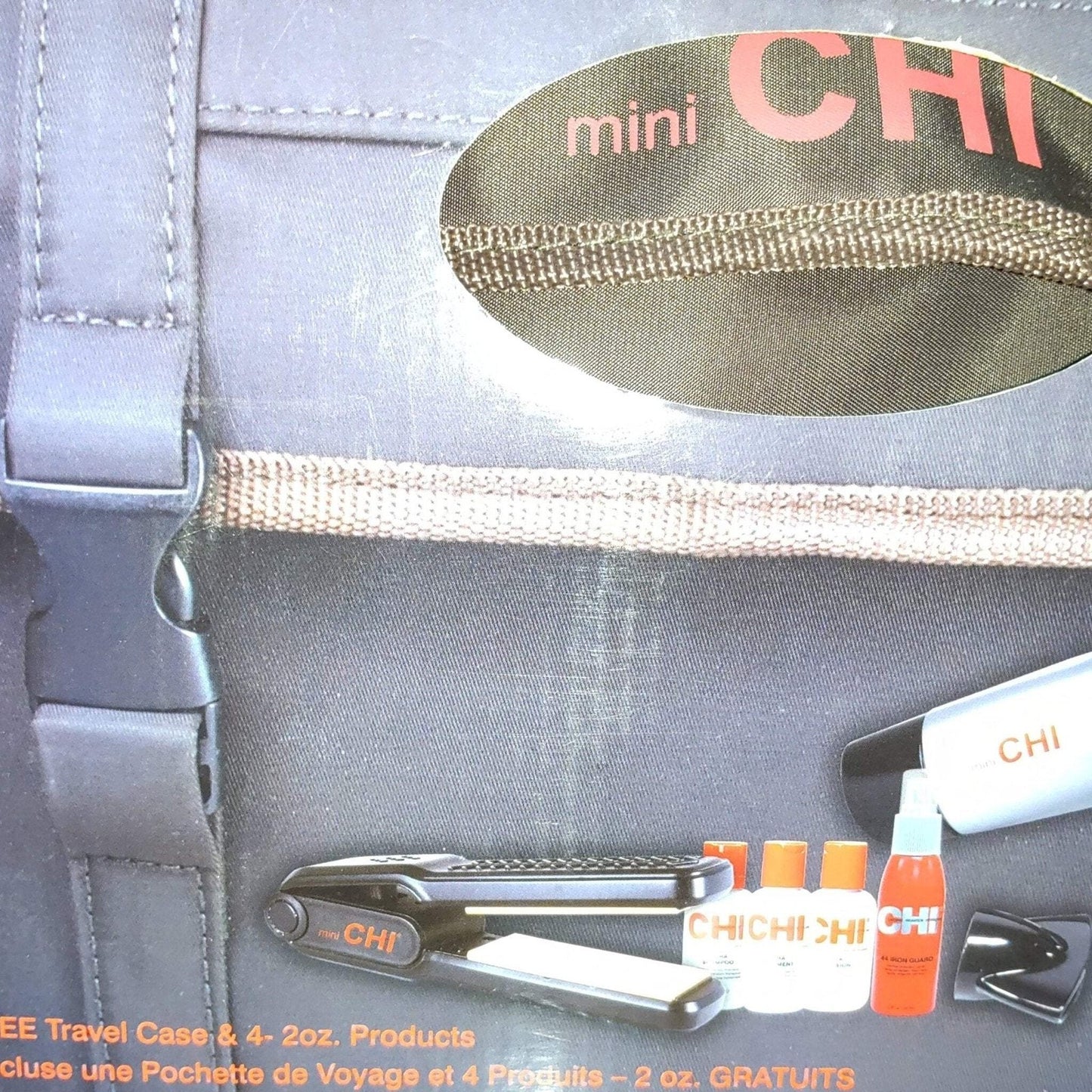 Compact black flat iron with orange CHI branding, accompanied by four small white and orange product bottles and a black travel case with a textured handle detail.