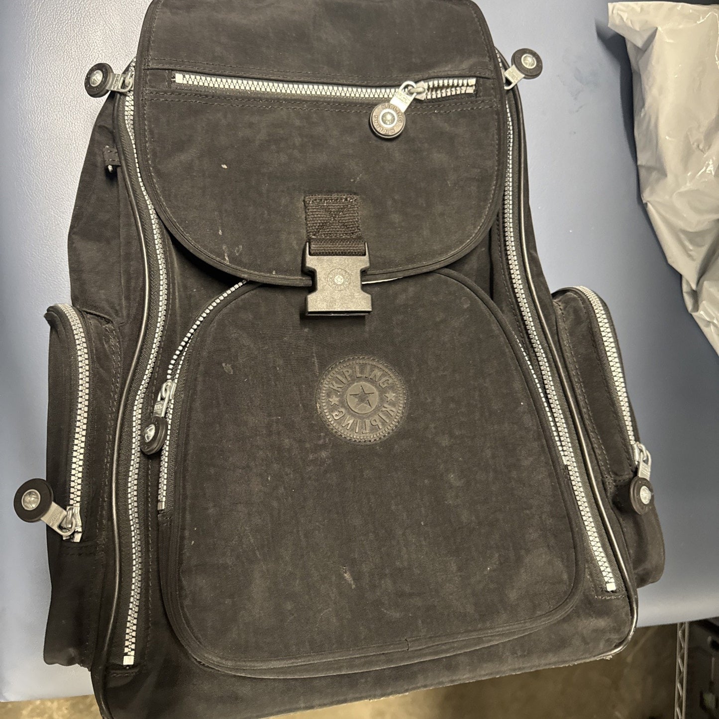 Pre-owned Kipling Gaze large black printed rolling backpack with multiple zippered compartments and front buckle closure