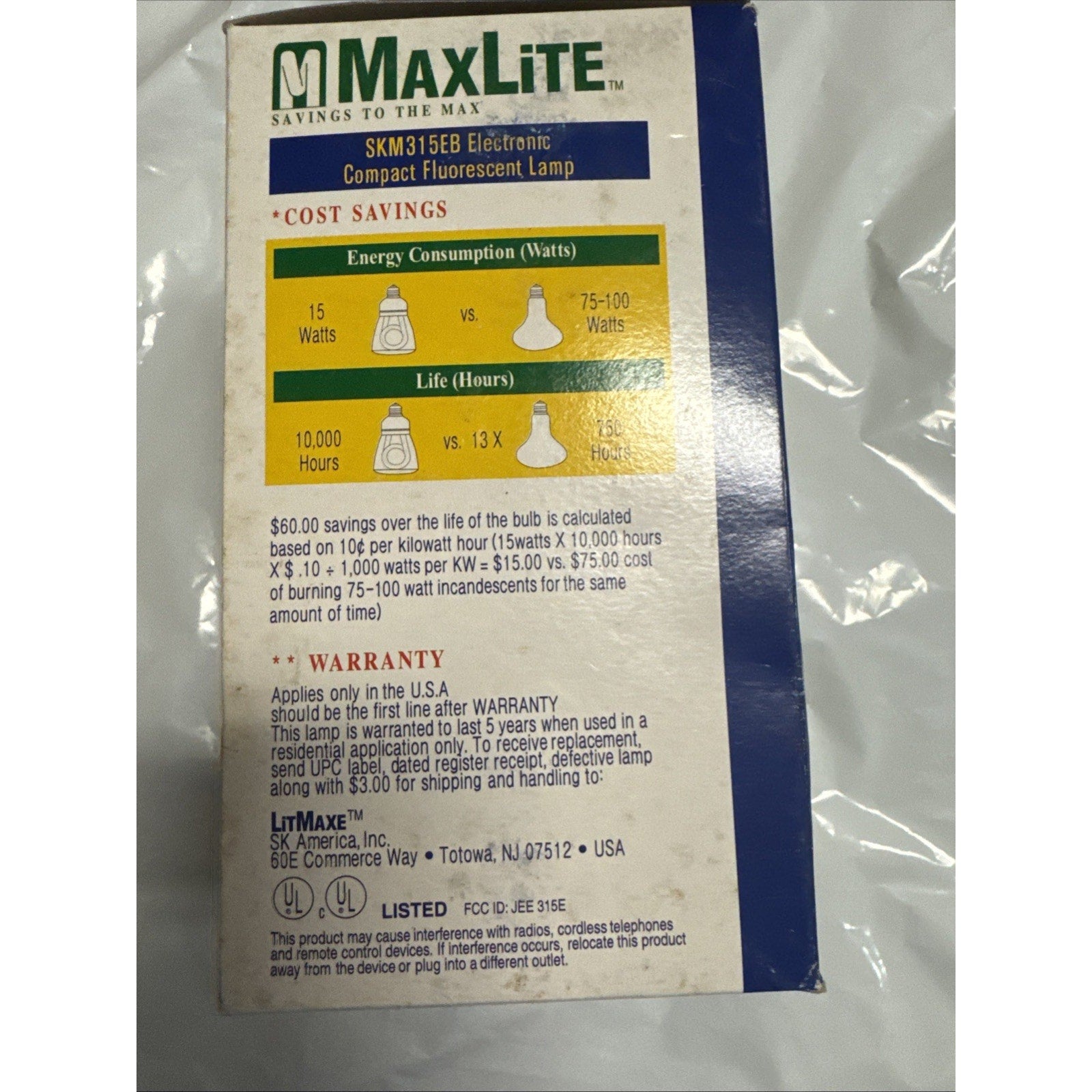 MaxLite SKM315EB 15W compact fluorescent lamp packaging showing energy savings and warranty details