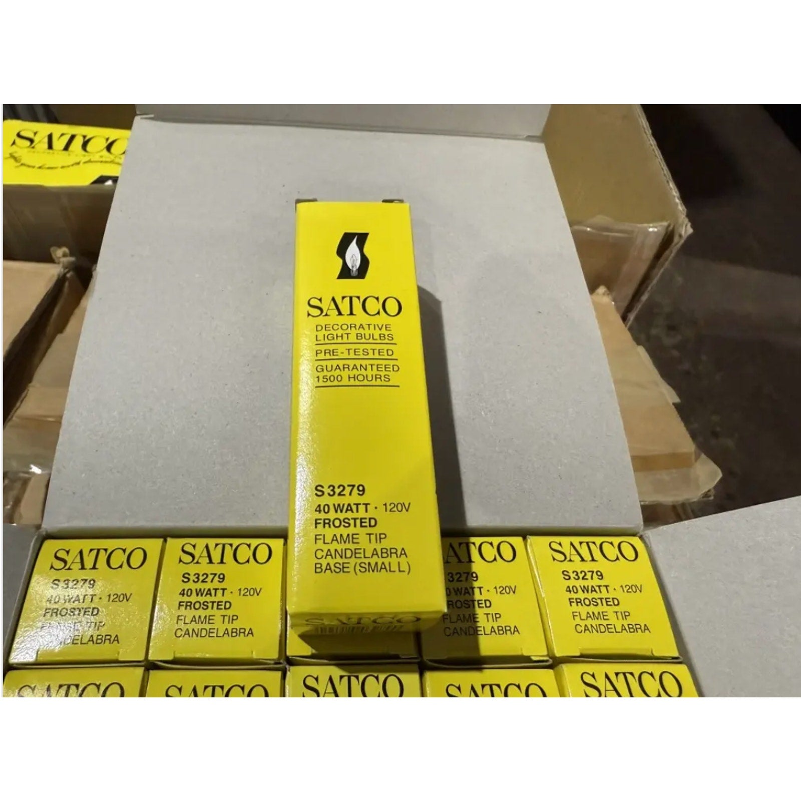 Satco S3279 frosted flame tip candelabra base bulbs 40W 120V yellow retail boxes stacked in carton