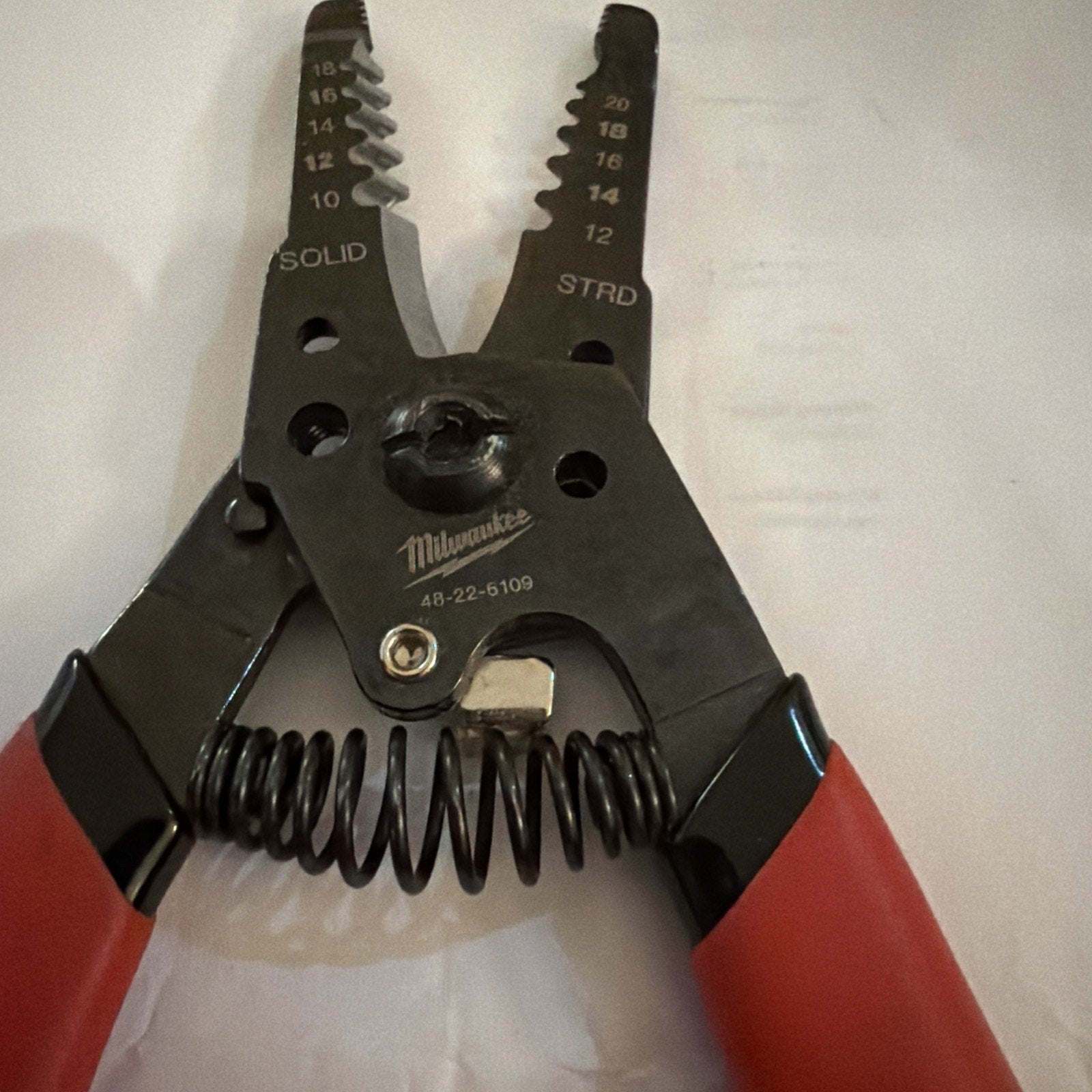 Milwaukee Automatic Wire Stripper with red handles for stripping 10 to 20 AWG solid and stranded wire sizes