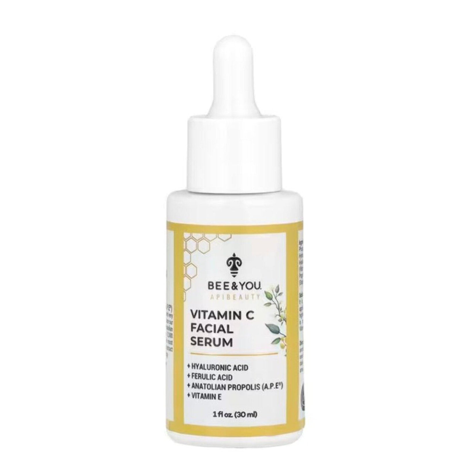 White dropper bottle of Bee & You Apibeauty Vitamin C Facial Serum with yellow-bordered label featuring key ingredients hyaluronic acid, ferulic acid, Anatolian propolis, and vitamin E.