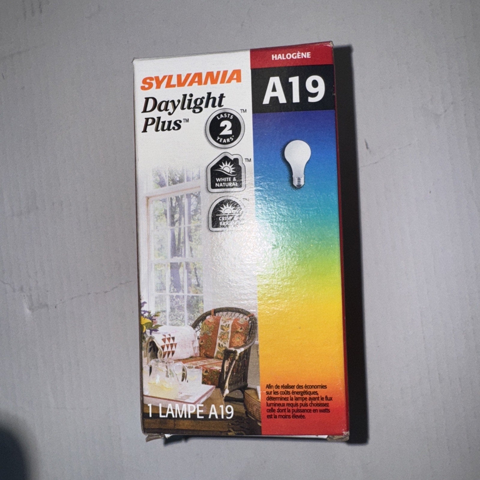 SYLVANIA Daylight Plus A19 halogen light bulb box showing product features and bulb shape illustration