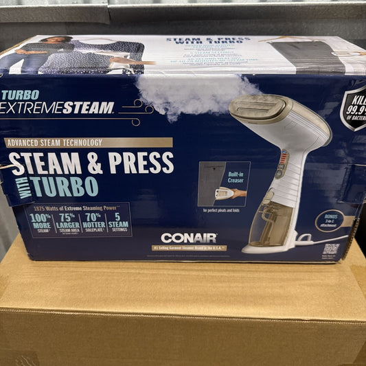 Packaging of a Conair Turbo Extreme Steam handheld garment steamer showing the steamer releasing steam, featuring built-in creaser, five steam settings, and claims of killing 99.9% of bacteria on fabrics.