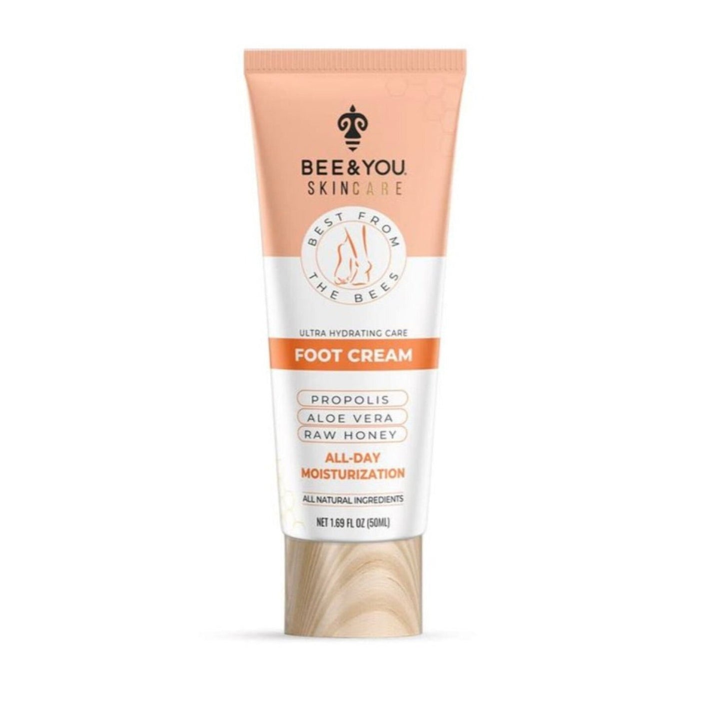 Tube of Bee & You Skincare foot cream with peach and white label, featuring propolis, aloe vera, raw honey, and all-day moisturizing, with a wood-textured cap on a white background.