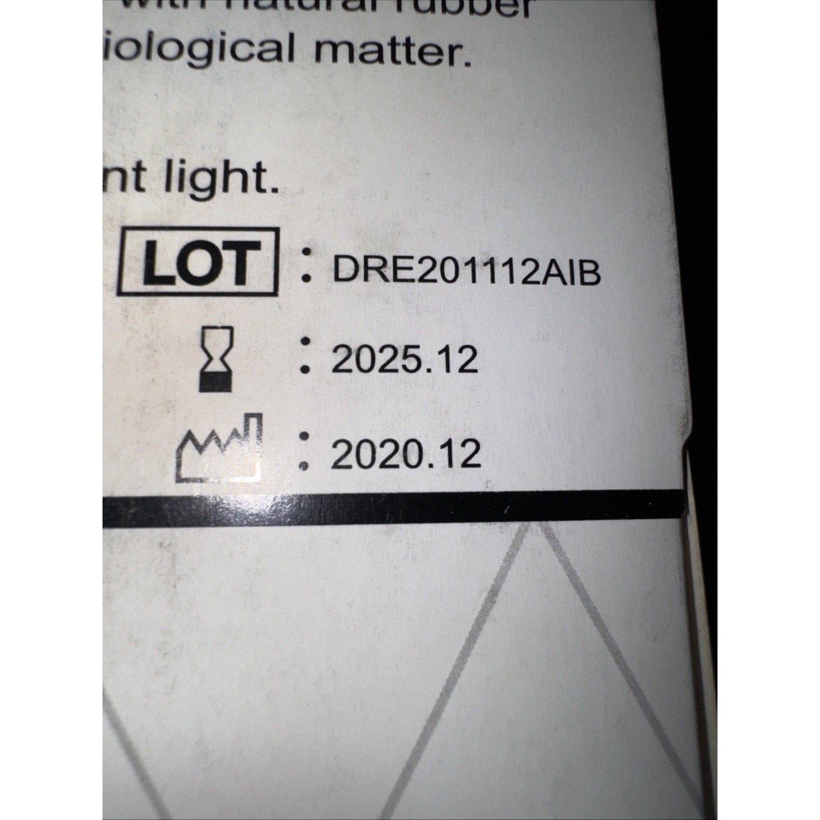 Lot number DRE201112AIB expiration date December 2025 and manufacture date December 2020 printed on glove packaging