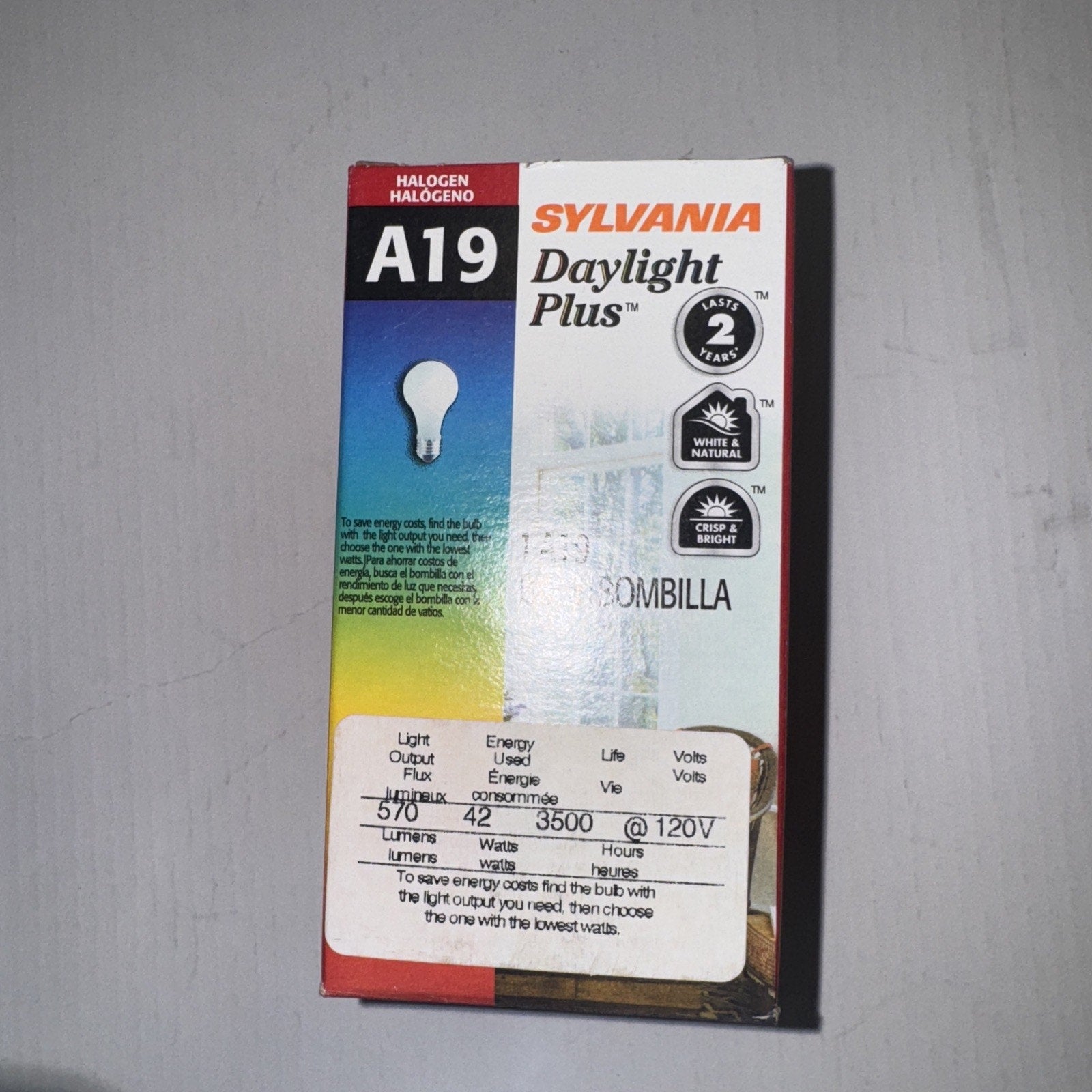 SYLVANIA A19 halogen daylight plus light bulb box showing energy and light output details on front