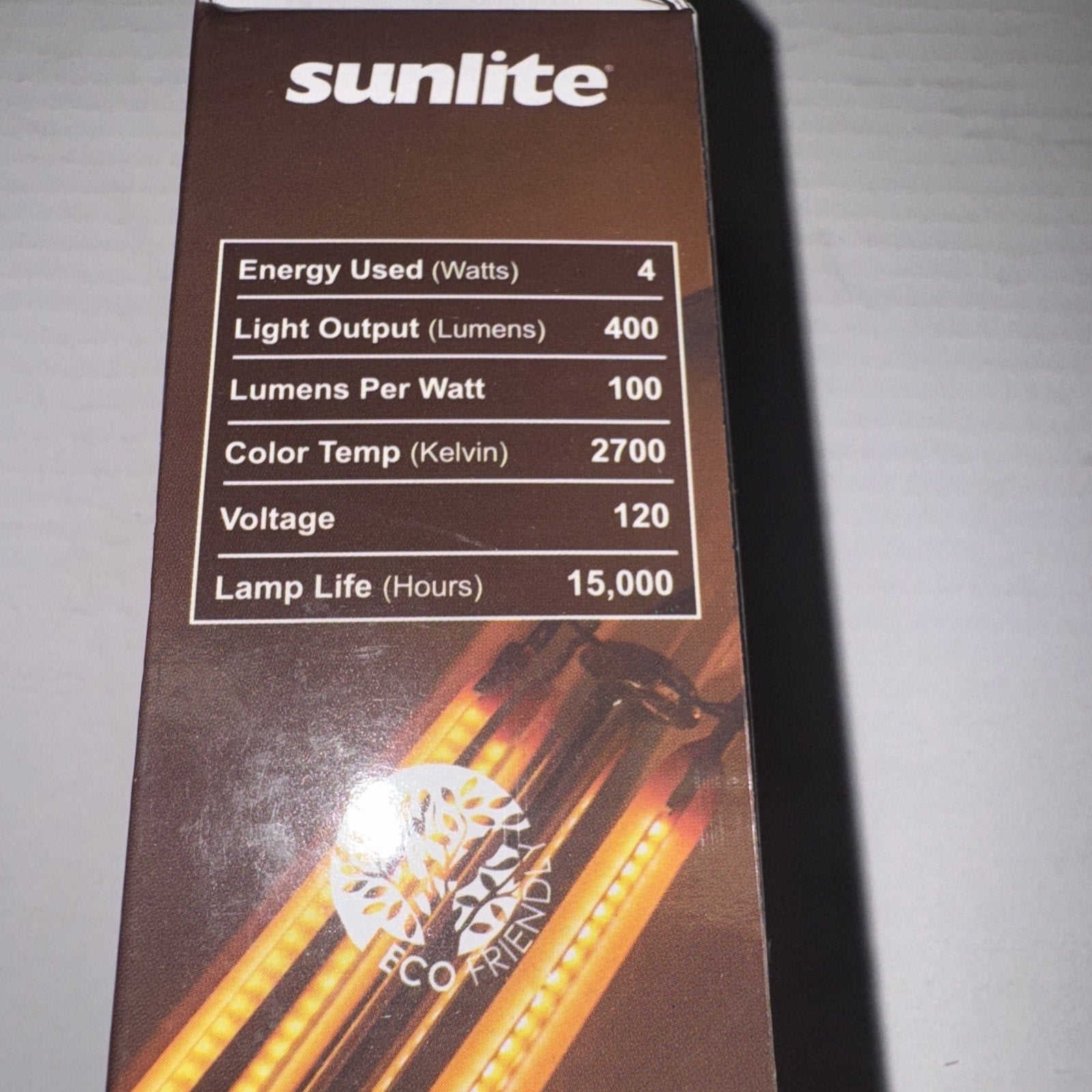 Sunlite LED filament chandelier bulb packaging showing energy use, lumens, color temperature, voltage, and lamp life details