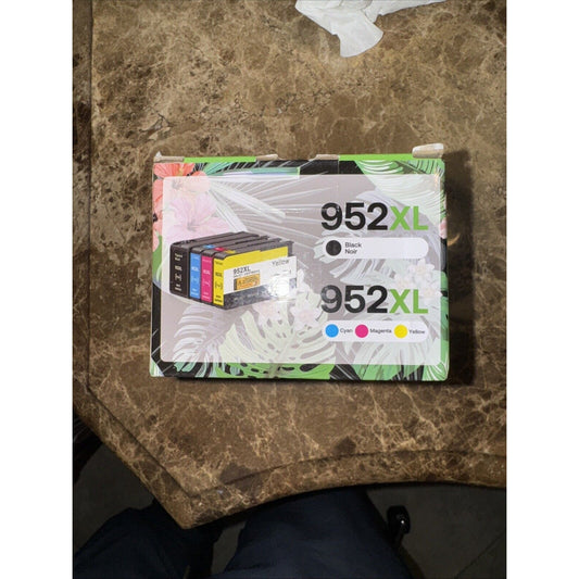 4 pack printer ink cartridges 952XL in black, cyan, magenta, and yellow with packaging showing color labels