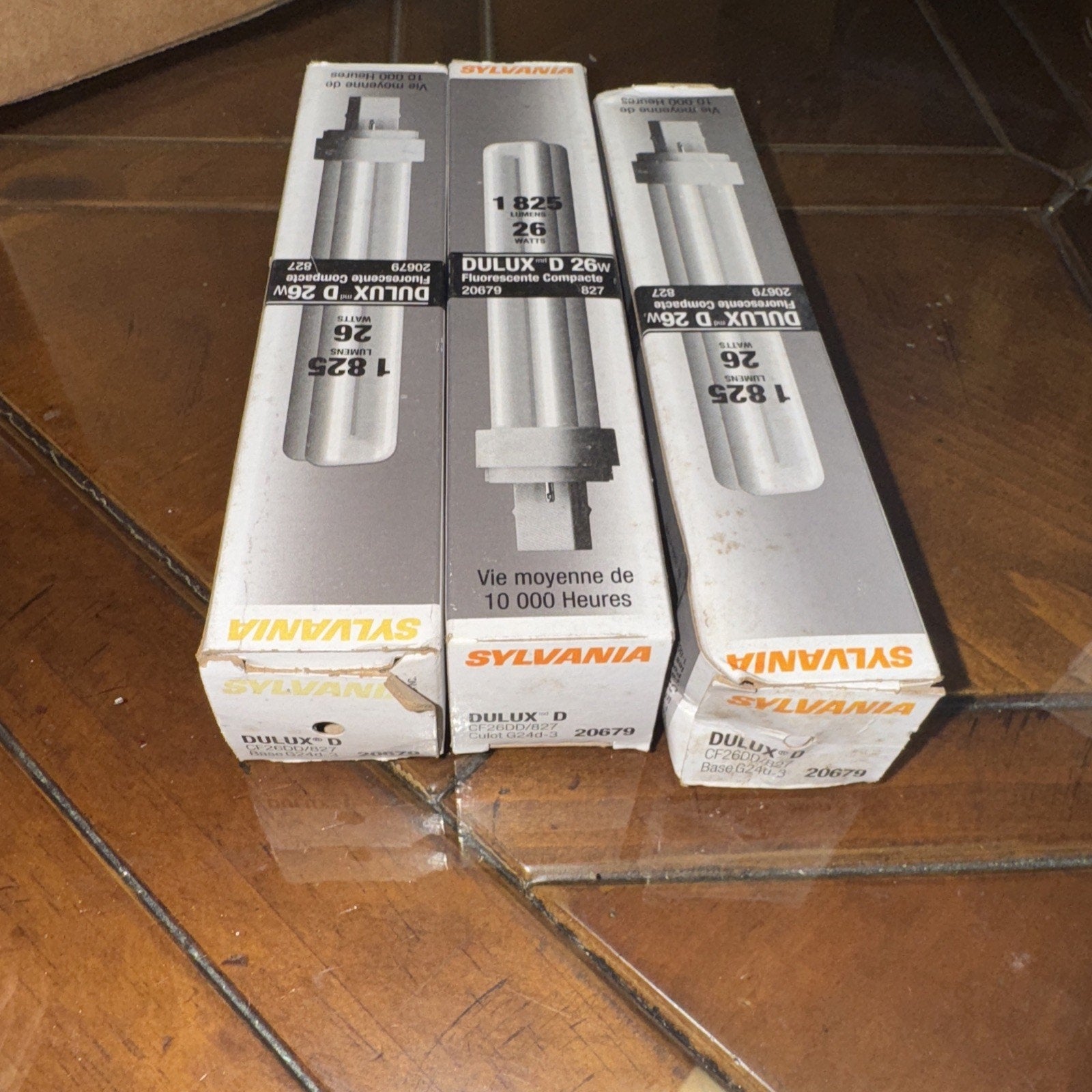 Three-pack Sylvania 20679 827 Dulux D 26 Watt compact fluorescent light bulbs in original packaging