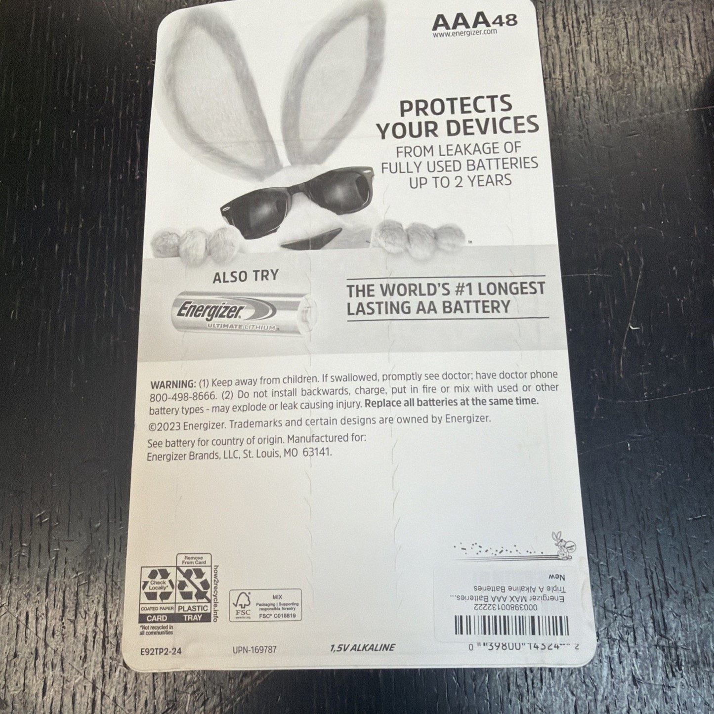 Back of an Energizer Max AAA battery pack showing the Energizer Bunny mascot wearing sunglasses, with text about protecting devices from battery leakage for up to two years and promoting the longest lasting AA battery.