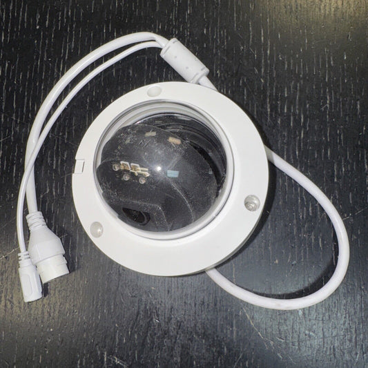 Alarm.com ADC-VC826 POE dome outdoor security camera with white casing and connected cables on black surface