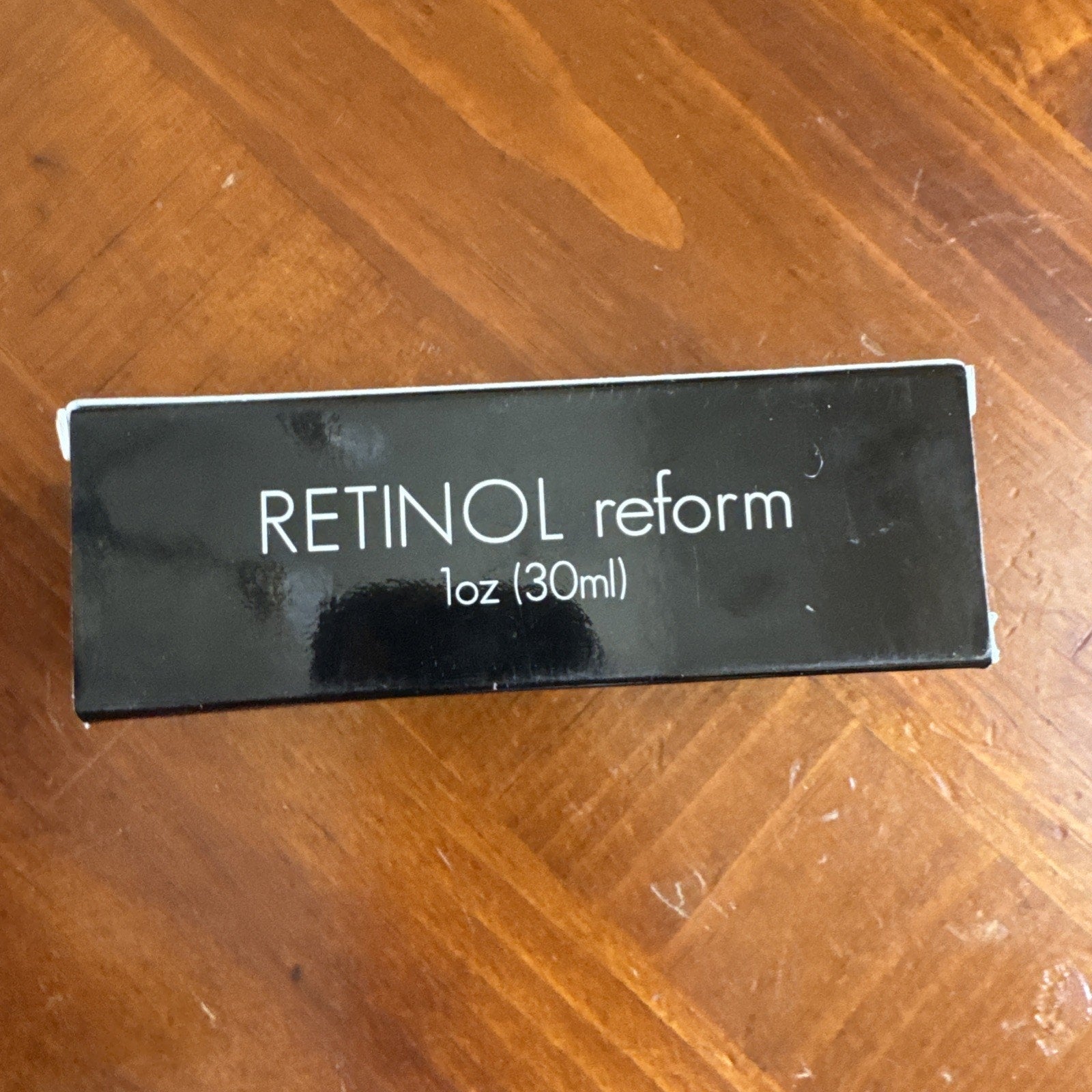 NEW SEALED BOX Resurface by Shani Darden Retinol Reform Peel 1 oz black packaging with white text on wood surface