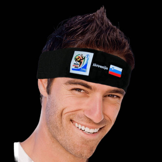 Man smiling while wearing a black sports headband featuring the 2010 FIFA World Cup South Africa logo, the word "Slovenija," and the Slovenian flag against a black background.