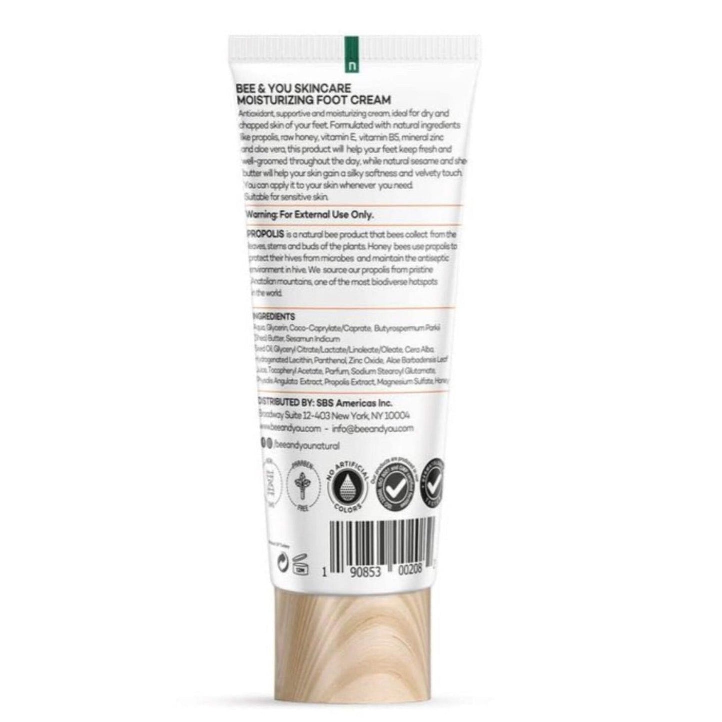Back of a moisturizing foot cream tube with detailed ingredient list, usage instructions, caution warnings, and company contact information, featuring natural and cruelty-free certification icons.