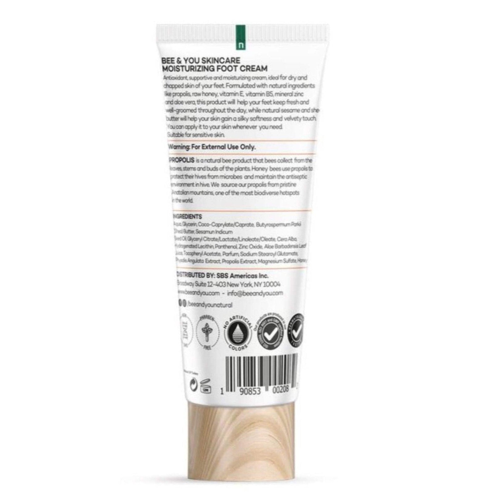 Back of a moisturizing foot cream tube with detailed ingredient list, usage instructions, caution warnings, and company contact information, featuring natural and cruelty-free certification icons.