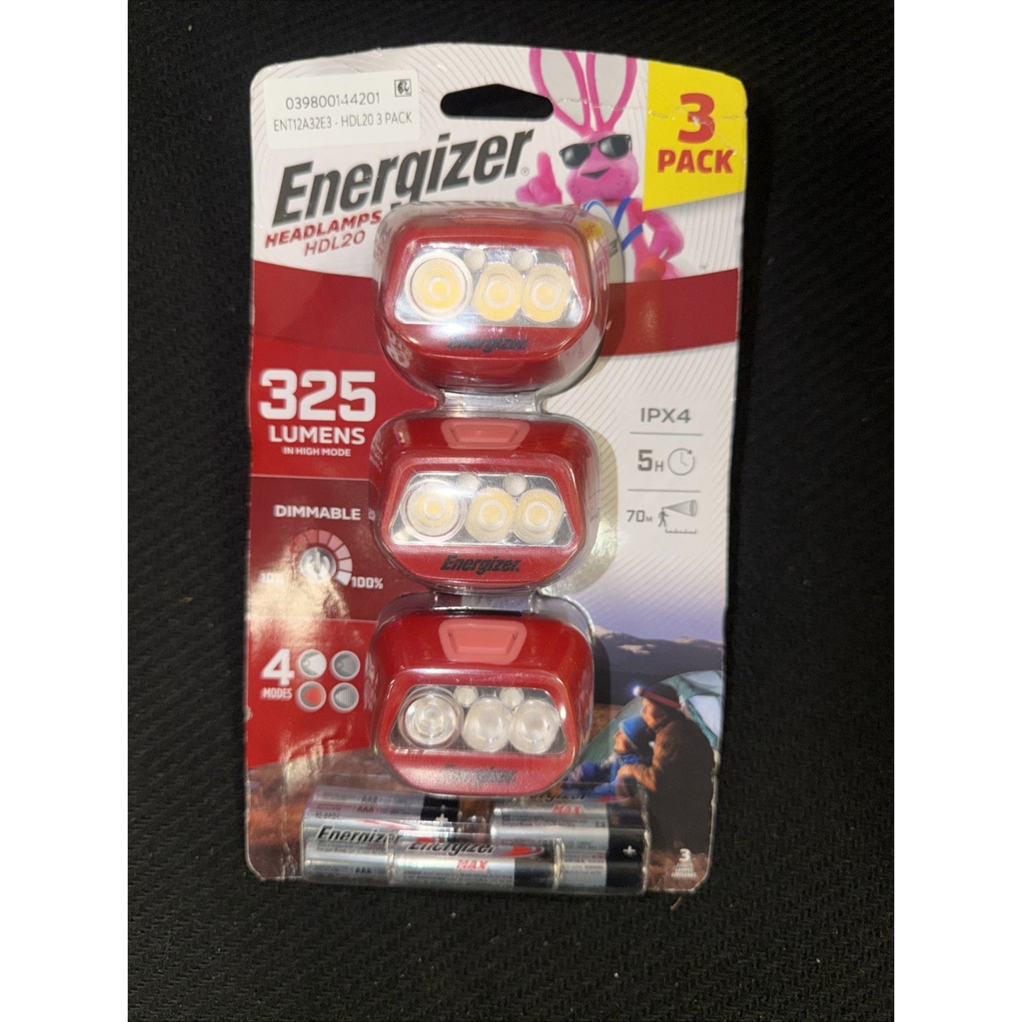 Package of three red Energizer headlamps with multiple LED lights, showing 325 lumens brightness, dimmable feature, four lighting modes, and included batteries on a white and red blister card.