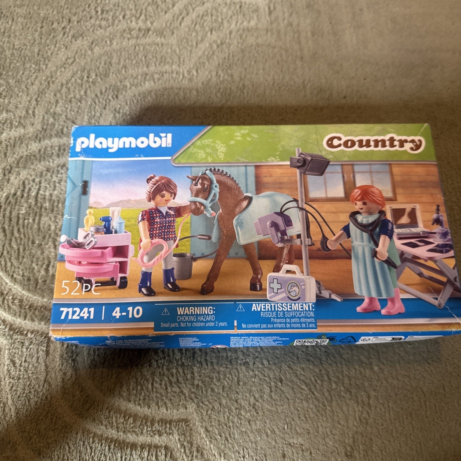 Playmobil 71241 Country Horse Veterinarian set with two figures, horse, and veterinary equipment in barn setting