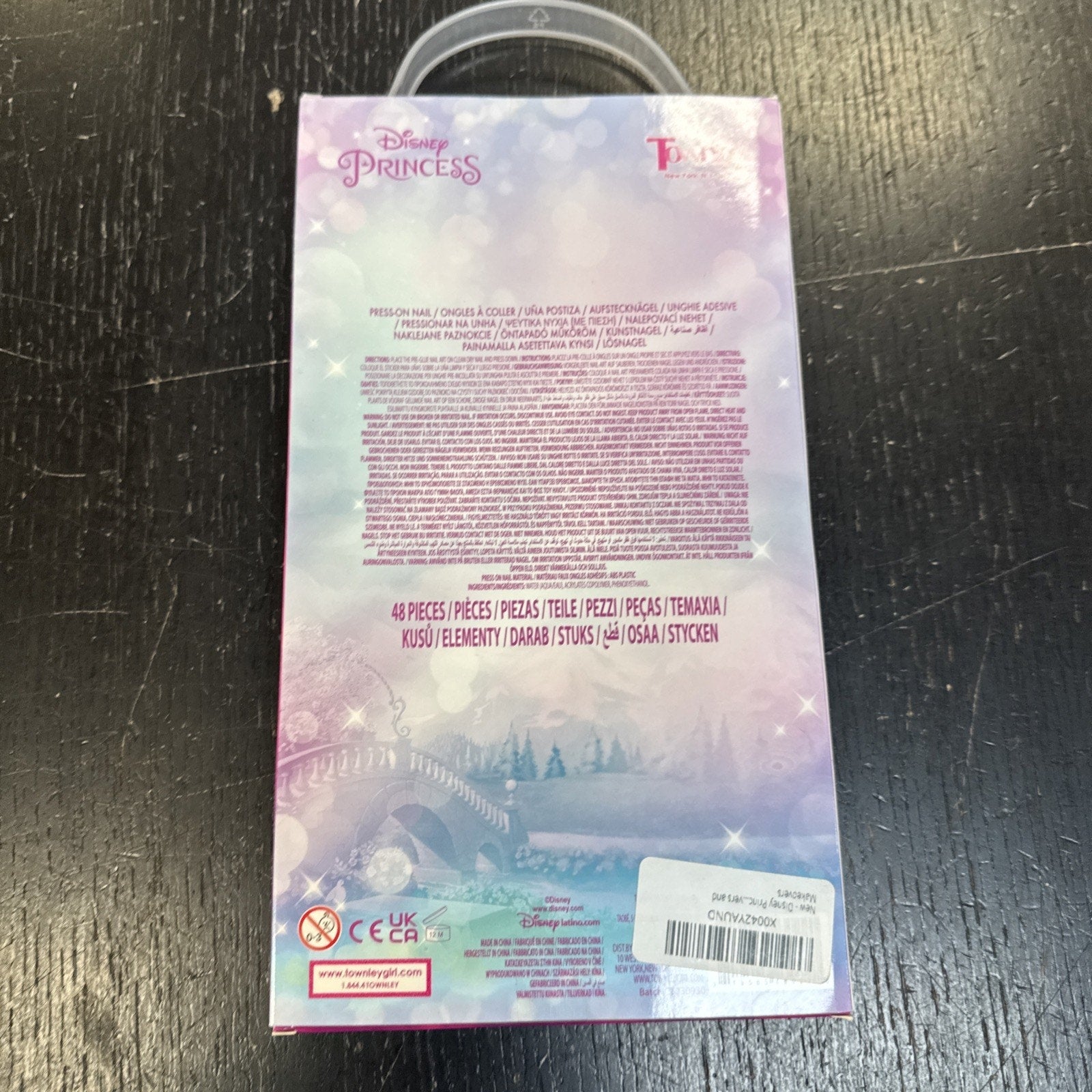 Back of Girl Disney Princess 48PCS Press-On Nails Set packaging with product details and pastel castle background