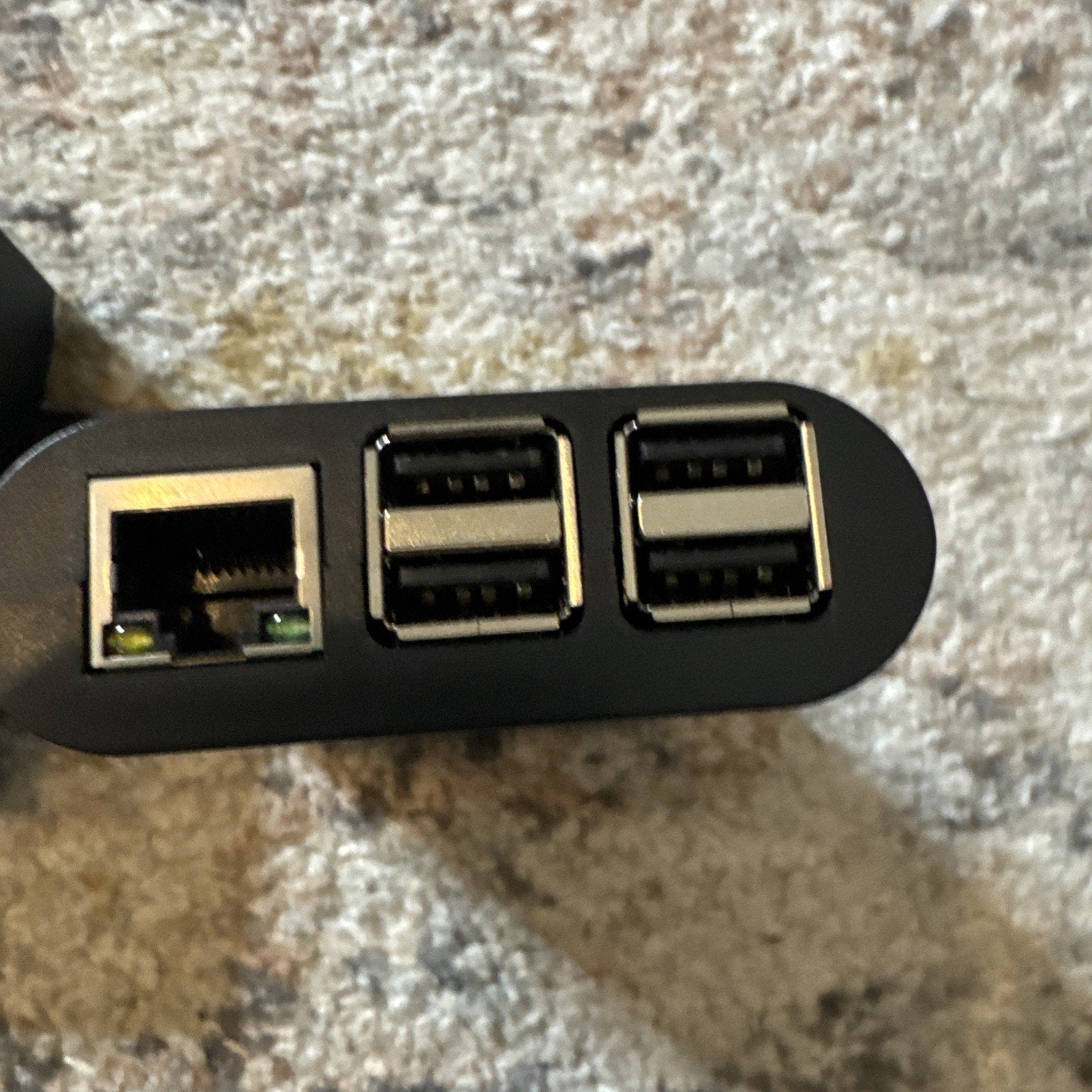 Close-up of 2 Revel Orbit and Guard scanner devices showing Ethernet and USB ports on black rectangular unit