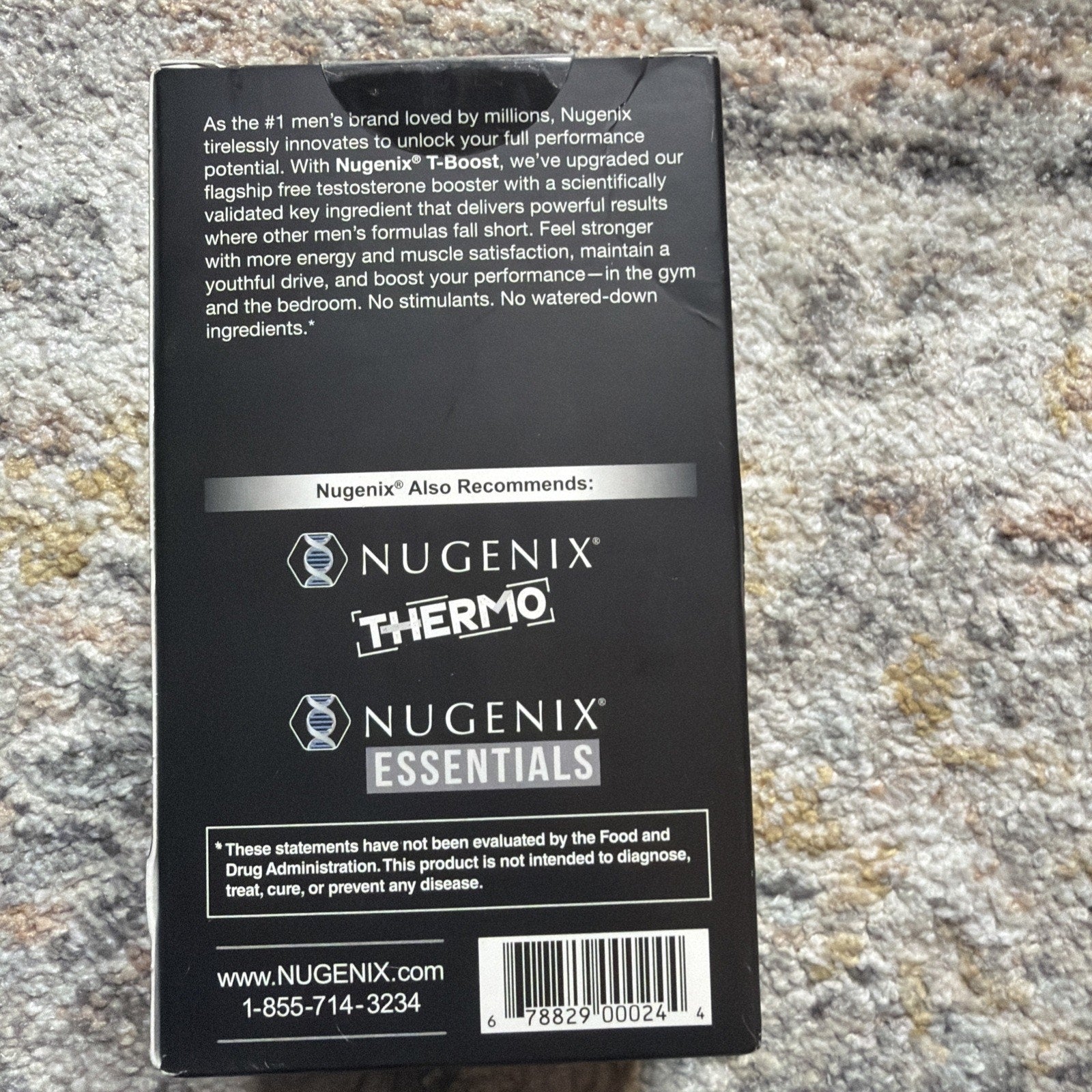 Back of a black supplement box featuring product information about a men's testosterone booster, recommending two other Nugenix products, a barcode, and contact details including a website and phone number.