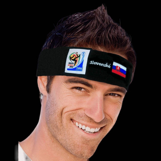 Smiling man wearing a black headband featuring the 2010 FIFA World Cup South Africa logo, the Slovakian flag, and the word "Slovenská" against a black background.