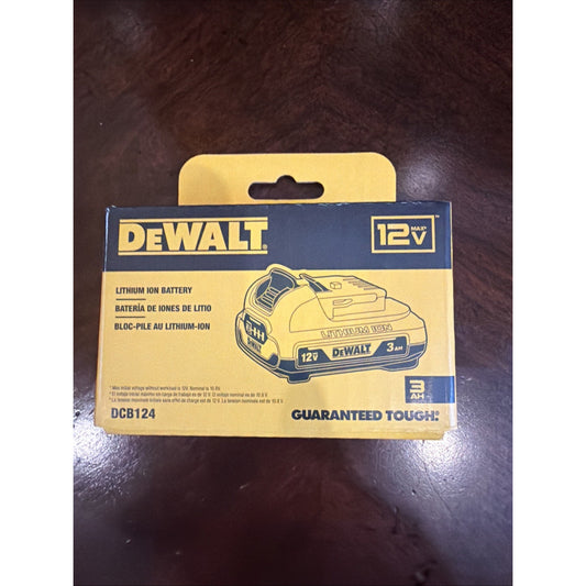 Yellow and black DeWalt packaging box for a 12V 3Ah lithium-ion battery, featuring an illustration of the battery and product details on a dark wooden surface.