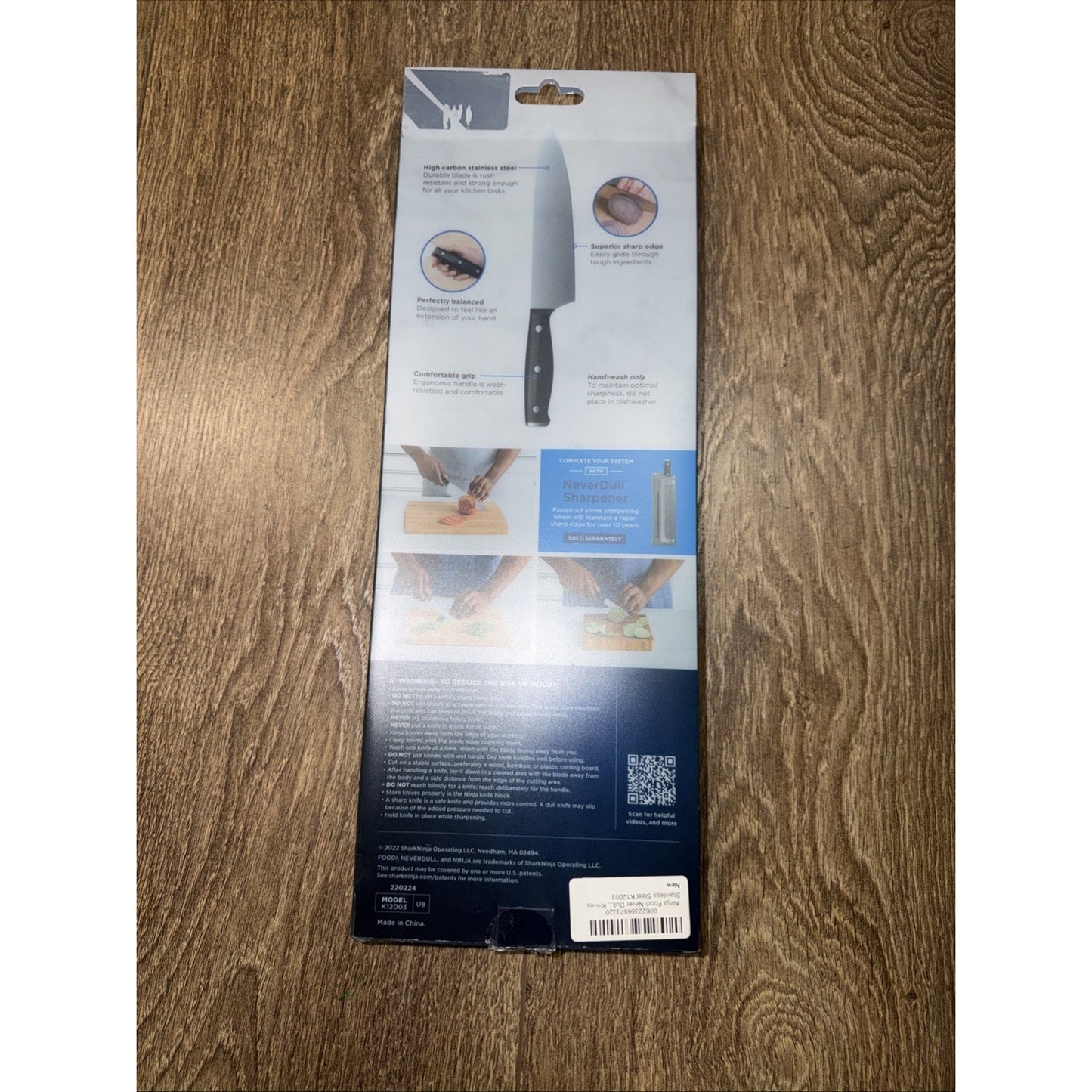 Back packaging of a kitchen knife set showing illustrations of knife features, usage instructions, safety tips, and a QR code on a wooden surface background.