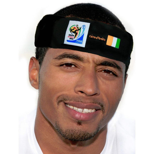Man wearing a black headband featuring the 2010 FIFA World Cup South Africa logo, the word "Côte d'Ivoire," and the Ivorian flag on a white background.