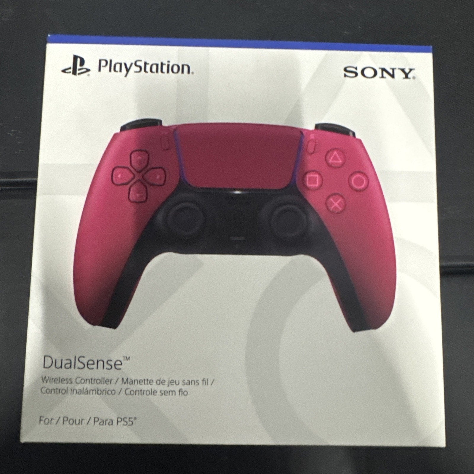 Sony PlayStation DualSense Wireless Controller in Cosmic Red shown on product box with PlayStation and Sony logos