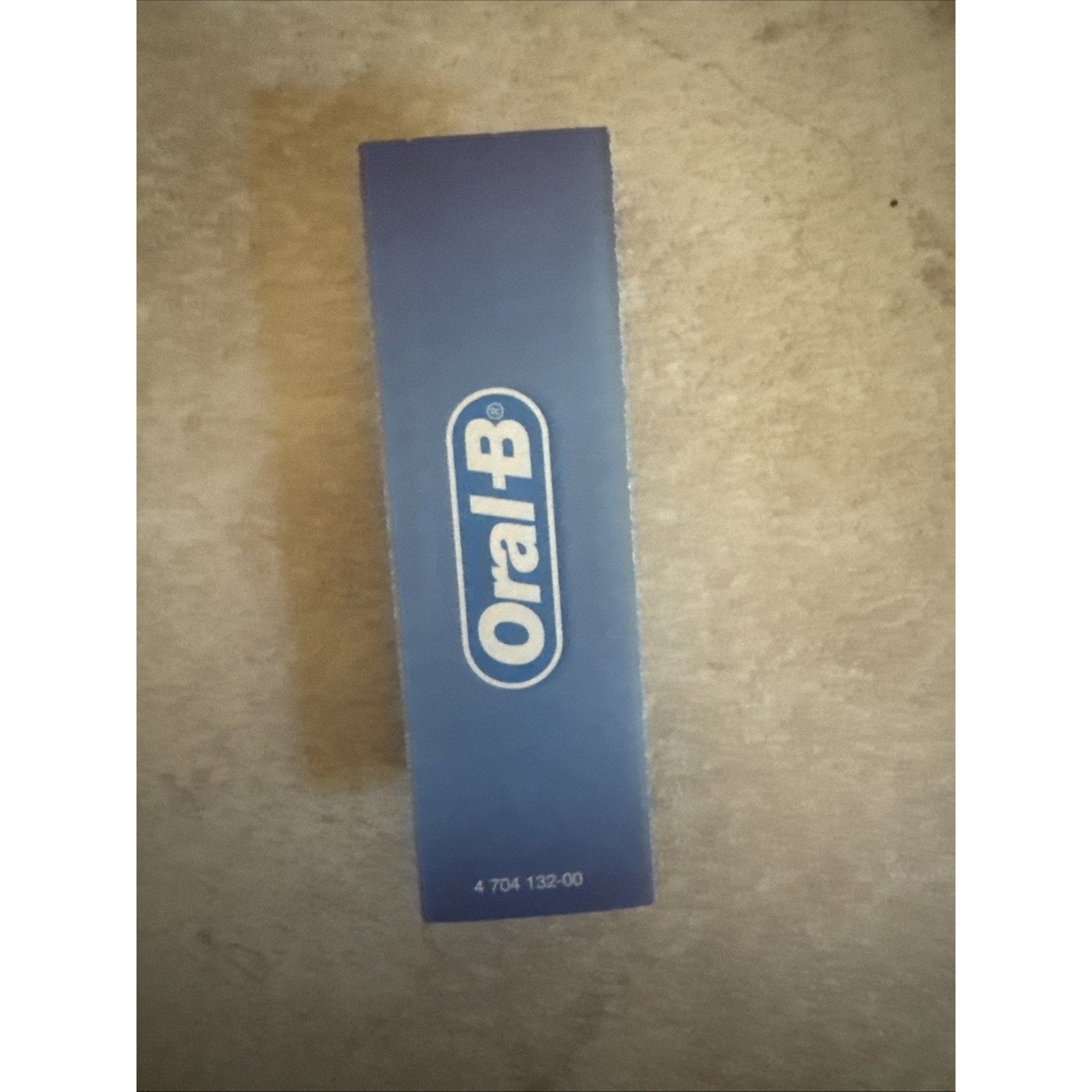 Blue box packaging of Oral-B electric toothbrush replacement heads with white logo on front