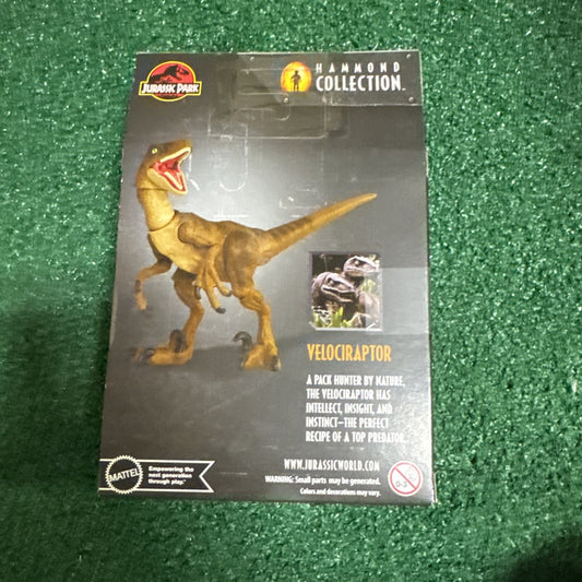 Jurassic Park Hammond Collection Velociraptor action figure packaging by Mattel showing raptor and logo