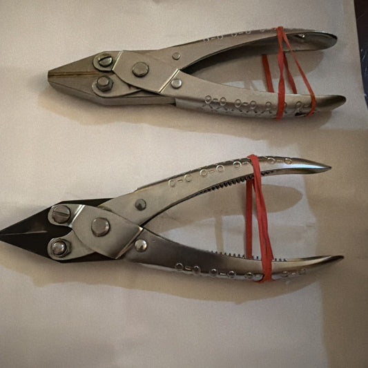 Pair of aviation snips sheet metal shears featuring left cut and straight cut blades with metal handles