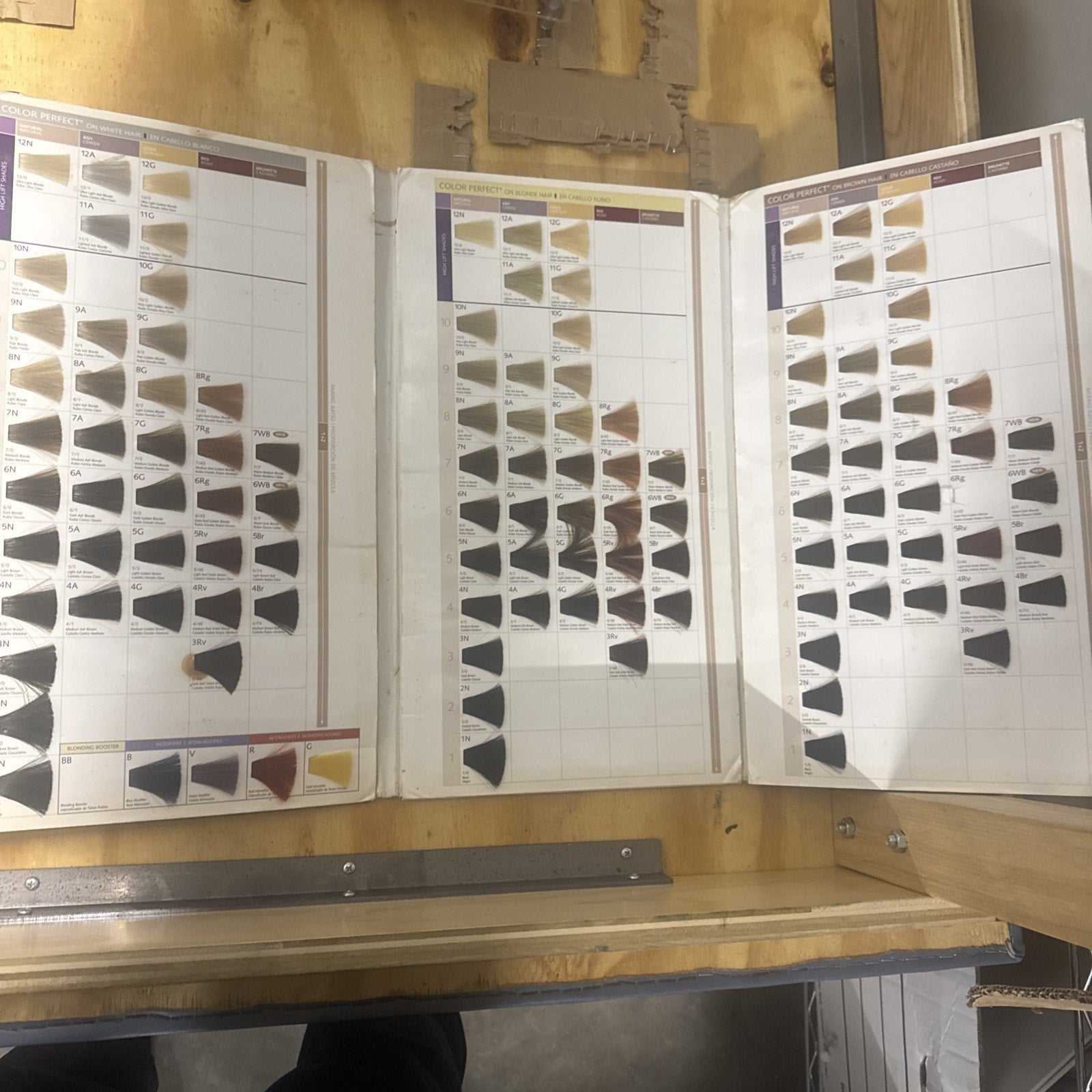 Wella Color Perfect Color Guide showing a range of hair color swatches in a tri-fold catalog format