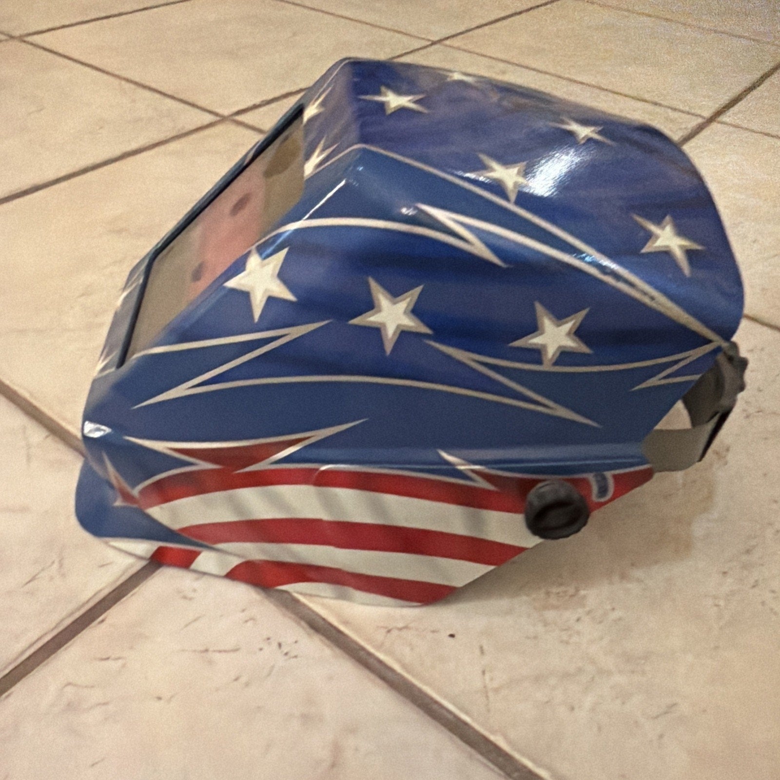 Jackson Safety HSL100 Glory welding helmet with auto-darkening lens featuring American flag star and stripe design