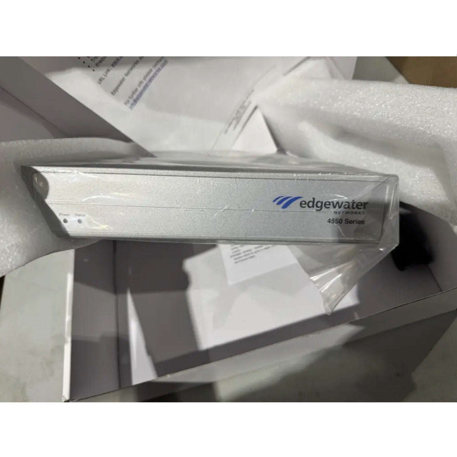 Edgewater Networks 4550 Series Gateway device in protective packaging showing front panel with logo and model number