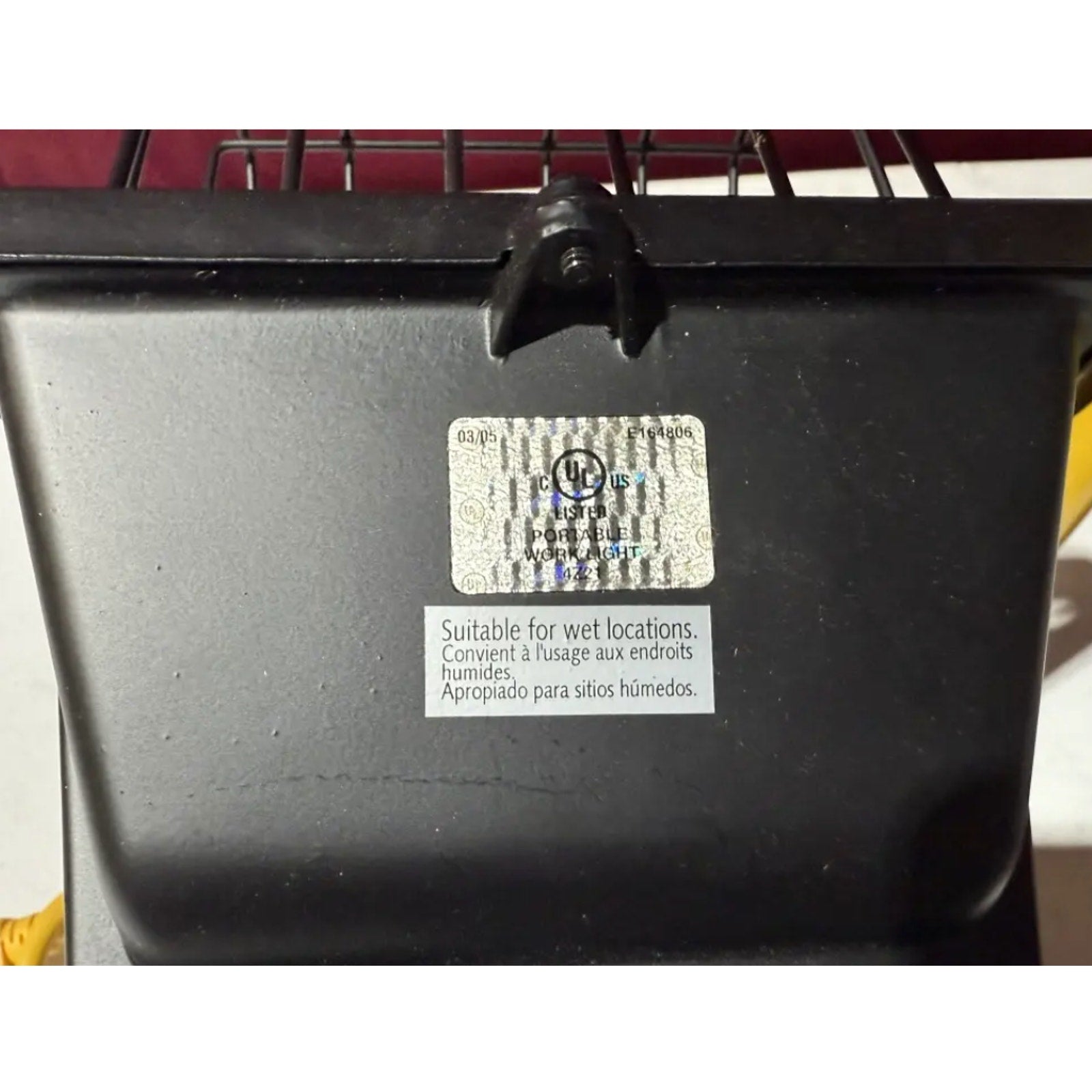Close-up of heavy duty work light model L 18 showing UL Listed label and suitability for wet locations warning