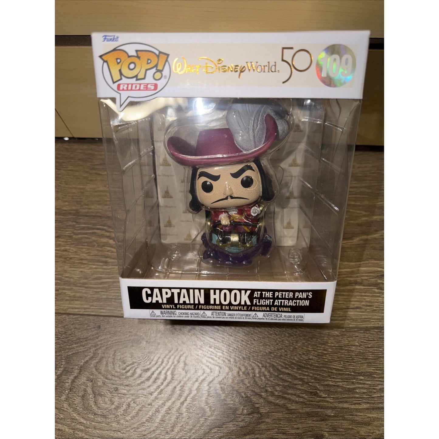 Funko Pop! Rides vinyl figure of Captain Hook from the Peter Pan's Flight attraction, packaged in a collectible box celebrating Walt Disney World's 50th anniversary.