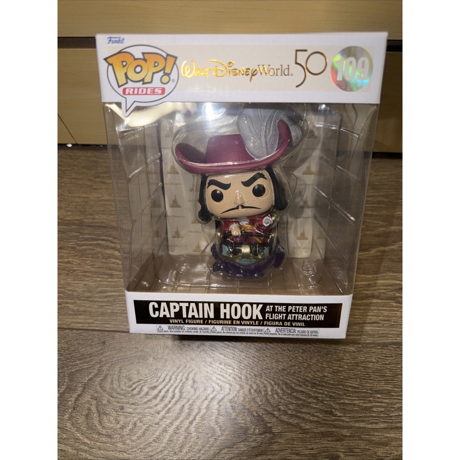 Funko Pop! Rides vinyl figure of Captain Hook from the Peter Pan's Flight attraction, packaged in a collectible box celebrating Walt Disney World's 50th anniversary.