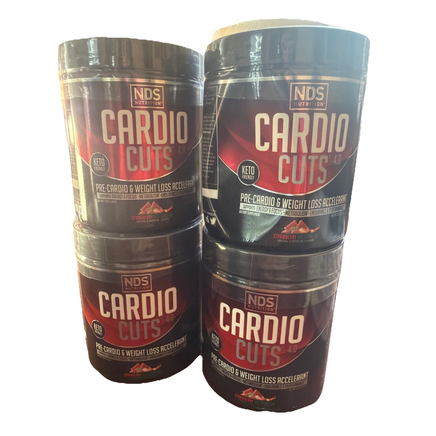 Four black containers of NDS Nutrition Cardio Cuts pre-cardio and weight loss accelerator supplement stacked against a plain white background.