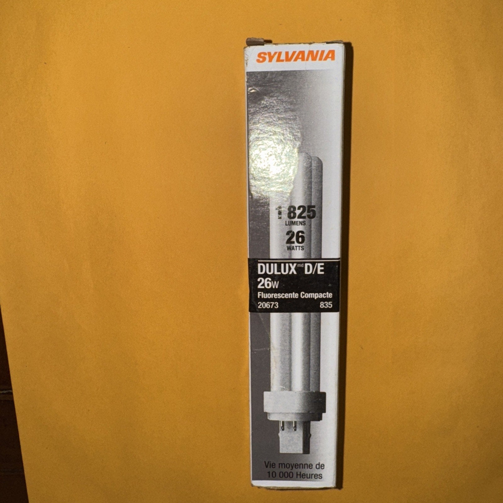 SYLVANIA 20673 CF26DD/E/835/ECO 26 watt compact fluorescent light bulb in white packaging with orange logo